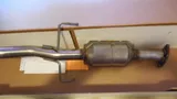 New aftermarket catalytic converter built into a section of exhaust pipe
