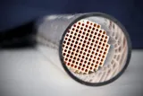 Cutaway catalytic converter showing the ceramic honeycomb inside the steel shell