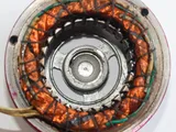 Inside a motor stator: copper windings packed into the slots of the steel core